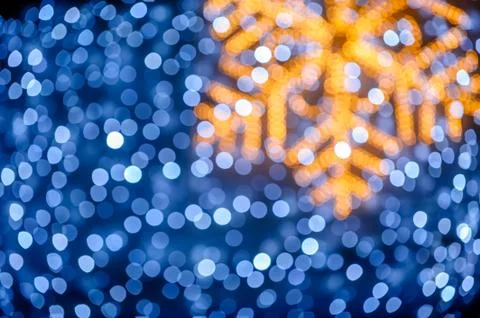 Blurred snowflake and lights background Stock Photos