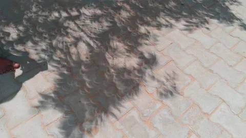 Blurred solar eclipse reflection on the floor. 4k clip Stock Footage 226985606