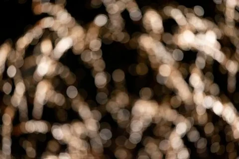 Blurred spots of rays from fireworks on a black background. Festive night bac Stock Photos