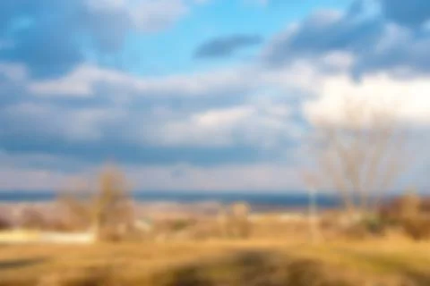 Blurred spring city background with clouds Foto stock