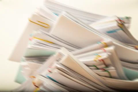 Blurred Stack of document paper with colorful paperclip with copy space Stock Photos