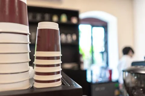 Blurred stack paper cup at coffee shop Stock Photos