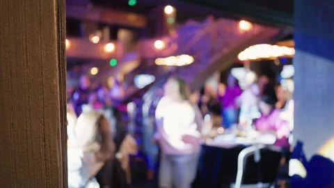Blurred stage lights and crowd energy capture lively backstage atmosphere with Stock Footage 333909902