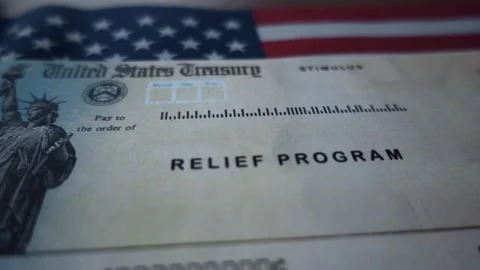 Blurred Stimulus check  relief program on Flag of USA, close up motion view. Stock Footage 146137984