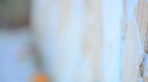 Blurred Stone Wall with Shallow Focus Motion through the Scene Stock Footage 33403680