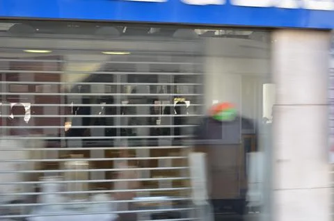 Blurred Storefront with Reflections and Shadows Stock Photos