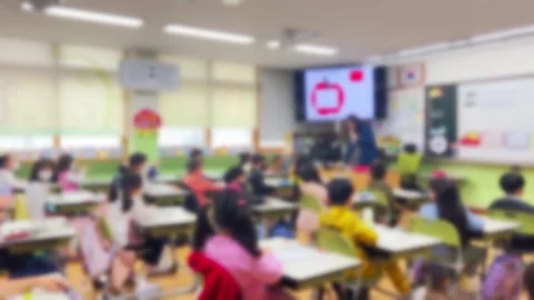 Blurred, students in elementary school classrooms with teachers Stock Footage 241709659