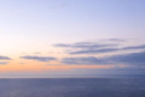 Blurred sunset. Background. Summer time and mood. Beautiful vibrant evening. Stock Photos