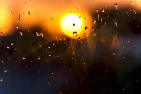 Blurred Sunset Background. View Window Glass. Rain Drops Sunset Bokeh . Stock Photos