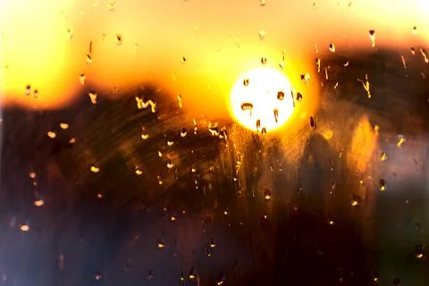 Blurred Sunset Background.  View Window Glass. Rain Drops Sunset Bokeh Stock Photos