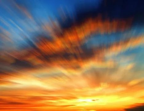Blurred sunset with clouds Stock Photos