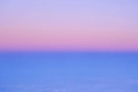 Blurred sunset in plane. Bright, saturated abstract background. Stock Photos
