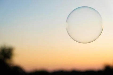 Blurred sunset sky background with soap bubble Stock Photos