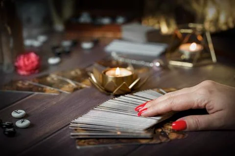 Blurred tarot cards on the table, esoteric concept, fortune telling predictio Stock Photos