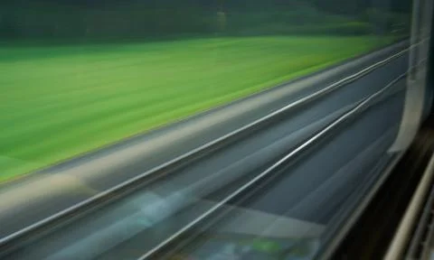 A blurred texture of the railway through the train window Stock Photos