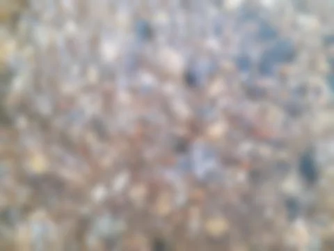 Blurred texture of the rock wall background is natural on background. Stock Photos