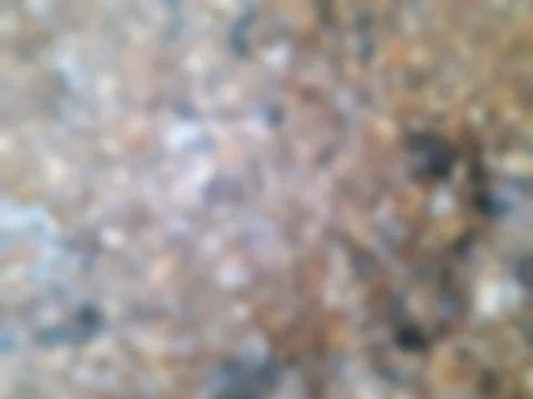 Blurred texture of the rock wall background is natural on background. Stock Photos