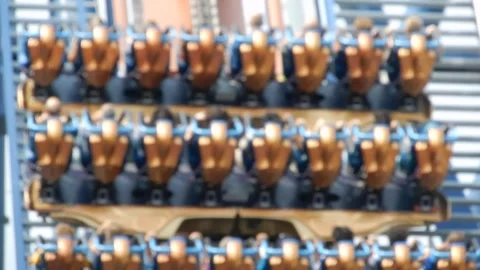 Blurred Thrill of Riders Ascending a Rollercoaster at Amusement Park Stock Footage 301712934