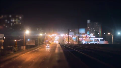 Blurred time lapse of night city traffic cars on illuminated roads Stock Footage 110876152