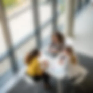 Blurred Top View Background of Three Female Colleagues Brainstorming Stock-Fotos