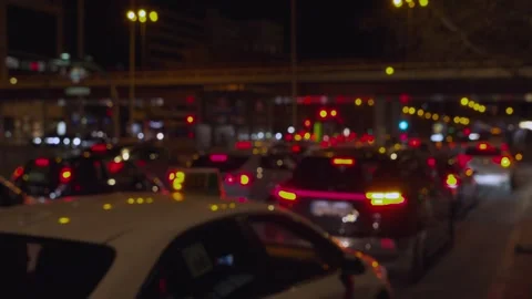 Blurred traffic jam lights glowing in a city at night Stock-Footage 329592673