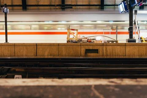 Blurred train motion with high speed at railway station Stock Photos