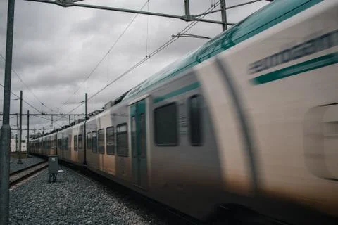 Blurred train motion with high speed at railway station Foto stock