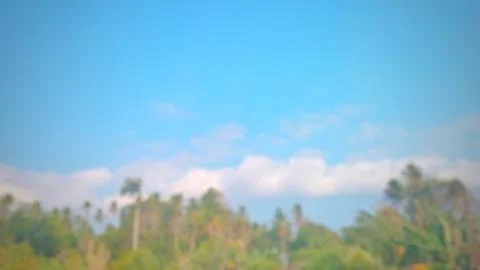 Blurred Trees and Clear Cloudic Sky in Rural Village Background Photos