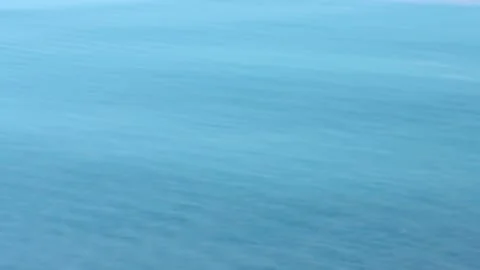 Blurred turquoise blue calm water smooth textured background Stock Footage 335540152