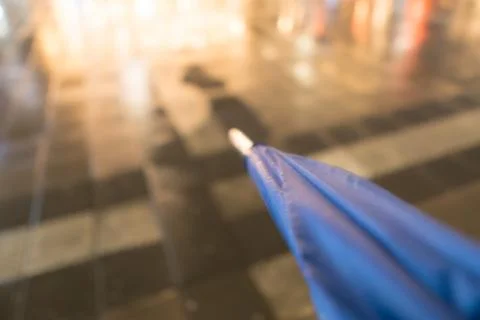 Blurred umbrella with rain drops Stock Photos