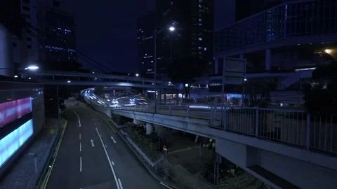 Blurred Vehicle Light Trails Sweeping Across Hong Kong Highway Overpass Stock Footage 329611581