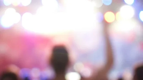 Blurred version. Group of cheerful active excited people dancing at musical Stock Footage 78613000