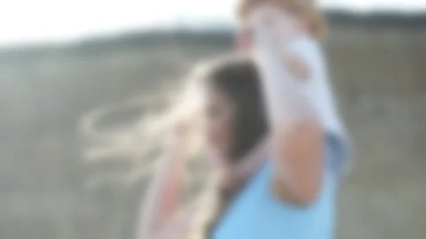 Blurred video of the coast with sand, mom and child walk on the sand Stock Footage 132897053