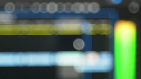 Blurred video editing software playing a clips in a timeline with audio meter Stock Footage 102179352