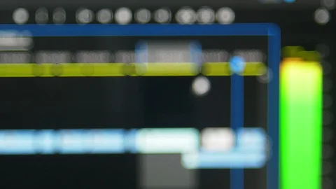 Blurred video editing software playing a clips in a timeline with audio meter Stock Footage 102180484