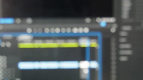 Blurred video editing software playing a clips in a timeline with audio meter Stock-Footage 102181434