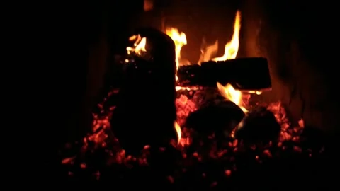 Blurred video of a warm fire by the fireplace in a romantic evening Stock Footage 168488489