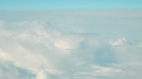 Blurred View from Airplane on White Air Clouds, Clear Blue Sky. Stock Footage 233118538