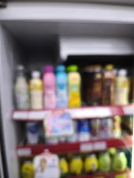 Blurred view of beverage fridge interior. Stock Photos