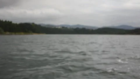 Blurred view of a boat ride under grey clouds Stock Footage 317962908