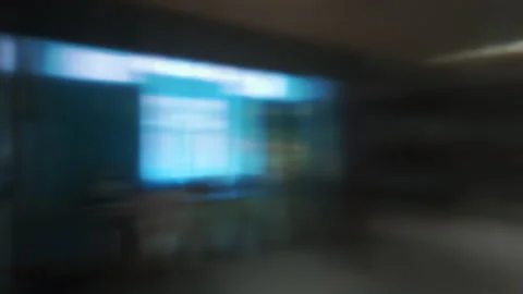 Blurred view of bright blue curtain filtering daylight through window, with.. Stock Footage 314607428