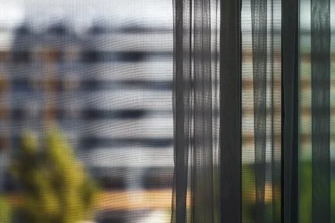 Blurred view of building through the window Stock Photos