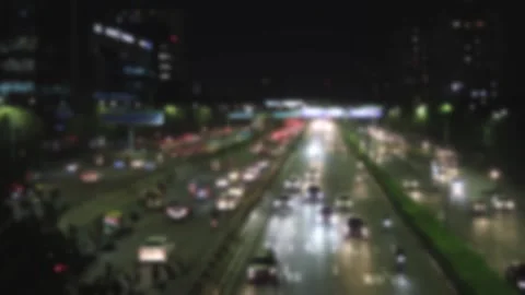 Blurred view of a busy evening road traffic on Raghvendra Marg Stock Footage 295369413