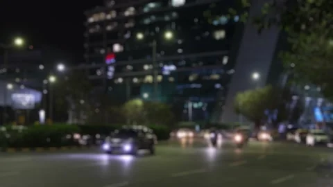 Blurred view of a busy evening road traffic in Gurgaon, India Stock Footage 303778466
