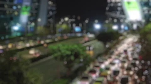 Blurred view of a busy evening road traffic in Cyber City, Haryana, India Stock Footage 303778473