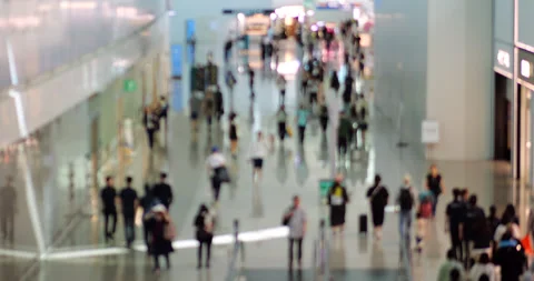 Blurred view of busy with passengers corridor in airport terminal Stock Footage 303992892