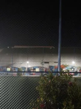 Blurred view captured through a mesh fence or slightly reflective glass Stock Photos