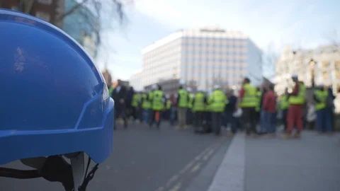 A blurred view of construction workers on a strike. Stock Footage 103533604