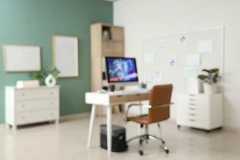 Blurred view of data scientist's office with workplace, pin board and diagram Stock Photos
