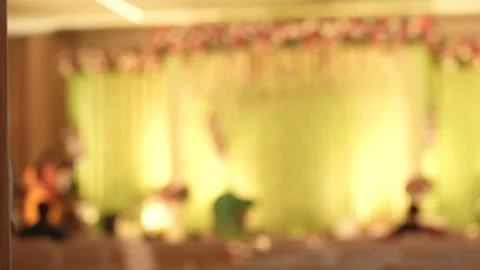 Blurred view of a decorated event stage with warm lighting Video stock 242813782